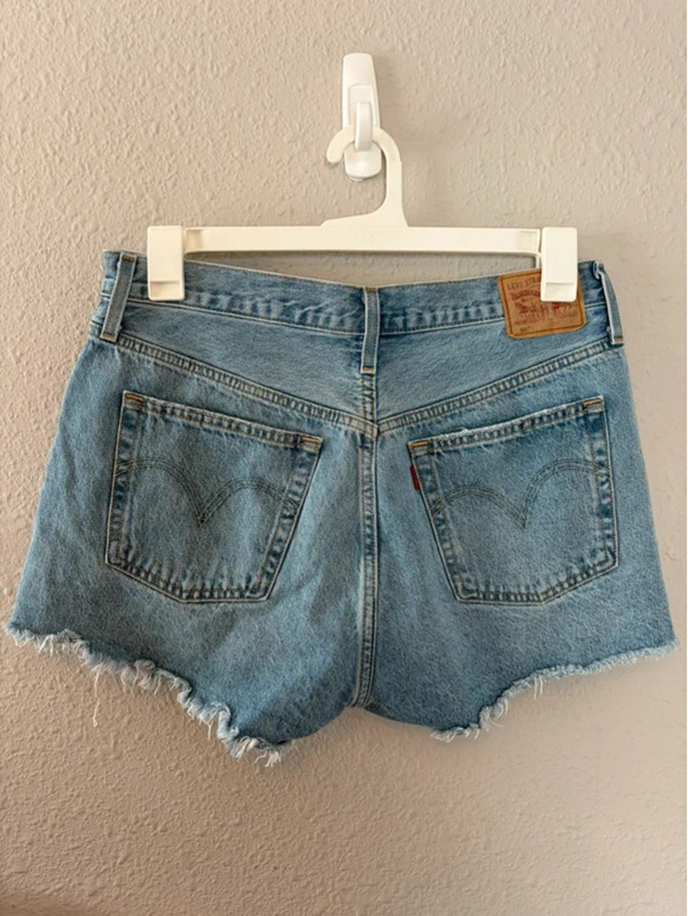 Levi's 501 light wash shorts size W31. 2.5in inseam. Spot on front
